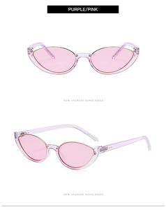 Detail view of purple cat-eye sunglasses with light pink lenses and metal rim accents