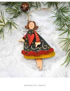 Detail of wooden Christmas angel ornament with real pine cone and rustic hemp rope