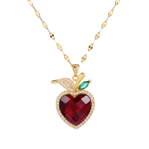 Luxury heart pendant necklace with red crystal and gold chain on white background