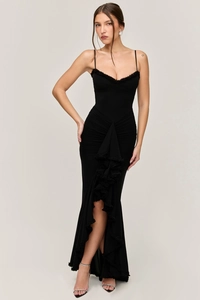 Detail view of the ruched texture and elegant ruffle trim on the black bodycon maxi dress