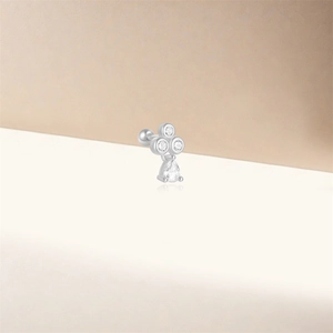 Macro view of S925 silver ear stud featuring a pear-shaped drop and screw ball back