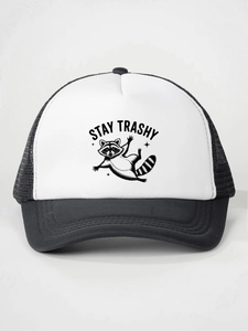 Detail of Stay Trashy raccoon print on a black and white mesh trucker snapback hat