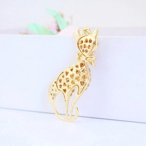 Cute gold hollow heart cat keychain pendant displayed on a premium white gift box
