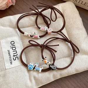 Set of cute cartoon dog and cat charm hair ties on elastic brown bands for women