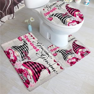 Three-piece bathroom mat set with pink heart gnomes and buffalo plaid patterns