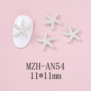 Macro view of 11mm starfish nail charms with white pearls and silver metal base