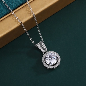 2ct round zircon halo pendant necklace with white gold plating on a jewelry box
