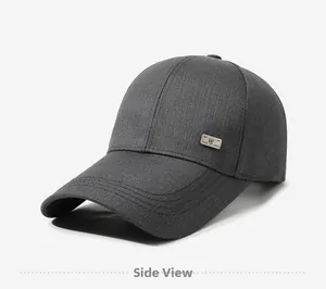 Side view of dark gray baseball cap showing the twill cotton fabric and metal logo plate