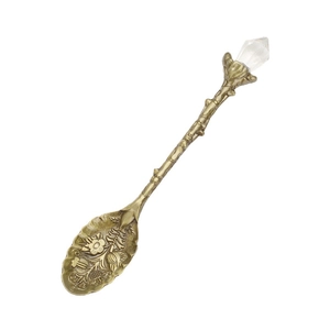 Vintage bronze alloy coffee spoon with carved patterns, leaf stem and crystal top