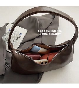 Spacious interior of retro brown PU leather shoulder bag showing large storage capacity