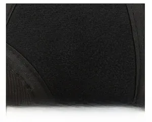 Close-up of the black thermal knit fabric texture on a winter baseball cap