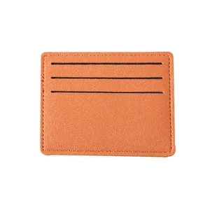 Slim brown lychee leather card holder with three horizontal slots for credit cards