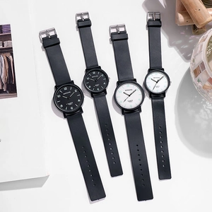 Minimalist quartz watches with black leather straps and classic Arabic numeral dials