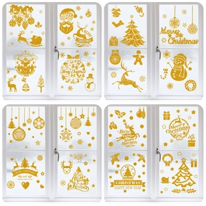 Detail of golden glitter Christmas window stickers featuring reindeer and snowflake designs