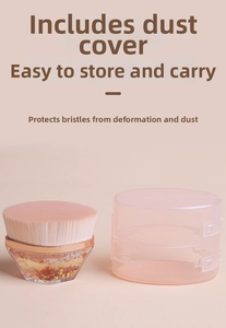 Detail of portable foundation brush with pink bristles and a clear sequin handle