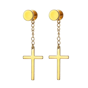 Detail of gold cross drop earrings featuring a circular stud and polished metal finish