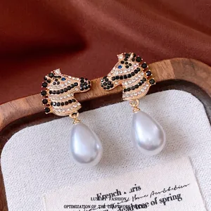 Vintage zebra head earrings with black and white crystals and large drop pearl pendants
