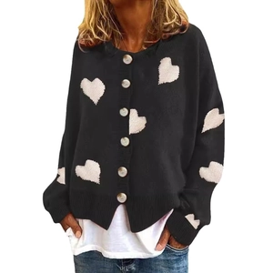 Black knit cardigan with white heart patterns and button-down front on a white background