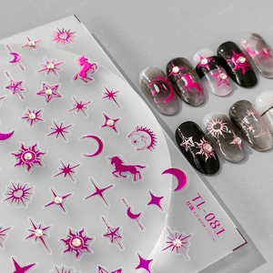 Embossed metallic pink nail stickers with celestial patterns and embedded rhinestones