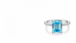 Macro detail of 4ct emerald cut aquamarine stone set in S925 sterling silver ring
