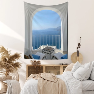 Detail of bohemian tapestry featuring Santorini sea view with white arches and blue ocean