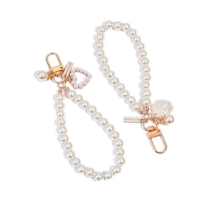 Elegant handmade pearl keychain set with golden heart and shell pendants in white