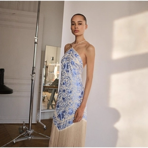 Elegant halter neck dress with blue floral print and beige long fringe tassel hemline