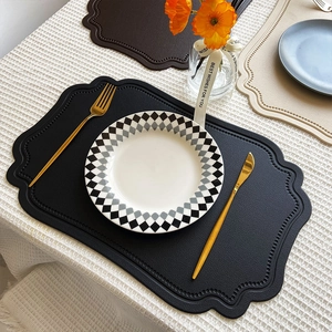 Irregular black faux leather placemat with heat resistance and waterproof nordic design