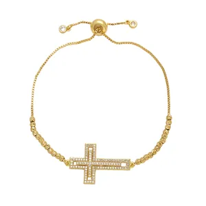 Minimalistisches goldenes Kreuzarmband für Damen mit Zirkonia und verstellbarer Zugkette