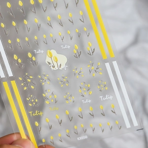 Close-up detail of KX050 3D embossed yellow tulip floral patterns on nail art stickers