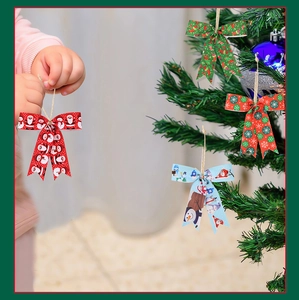 Christmas party ribbon bows with Santa and snowman patterns hanging on a green tree