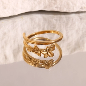 Detail of 18K gold plated stainless steel double layer ring with floral leaf patterns