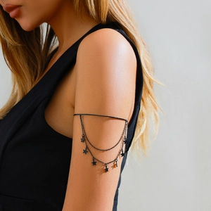 Detail view of gothic black multi-layer arm chain featuring five-pointed star pendants