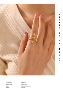 Detailed view of an adjustable 18k gold snake ring with realistic scale texture