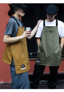Detailed view of heavy-duty canvas work aprons with large front pockets for professionals