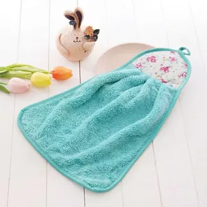 Detail of light blue coral fleece hand towel with pink floral trim and hanging loop