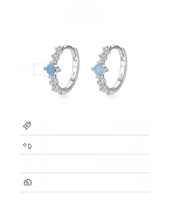 Detail of 925 sterling silver hoop earrings with blue zircon and S925 hallmark stamp