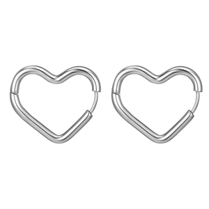 Macro detail of heart-shaped stainless steel earrings with polished silver finish