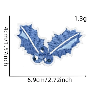 Blue holly leaf embroidered patch with white border measuring 6.9cm x 4cm and weighing 1.3g