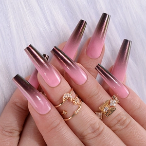 Detailed view of long ballerina nails featuring a shimmering pink to brown cat eye gradient