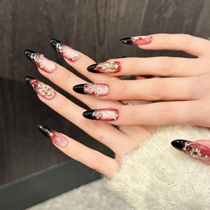 Handmade almond press-on nails with black-red cat eye gradient and ruby rhinestones