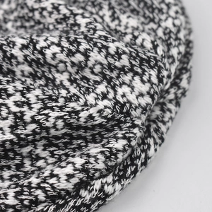Unisex black and white knit beanie featuring soft variegated yarn and chunky texture