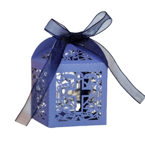 Elegant blue paper favor box with laser-cut cross design and matching ribbon for weddings