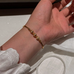 18K gold plated bamboo wrinkle bracelet with three hollow spherical zircon beads