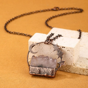 Vintage bronze necklace with celestial moon stars and a natural light purple crystal druzy