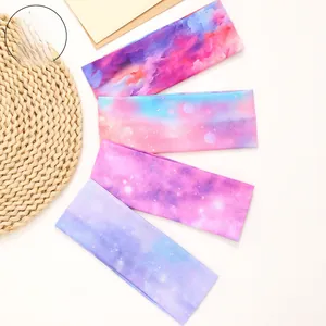 Detailed close-up of four bohemian wide headbands with galaxy and watercolor patterns