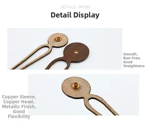 Detail showing smooth walnut wood clock hands with solid brass sleeve reinforcements