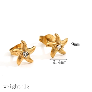 Detailed view of gold starfish earrings with zircon center and precise dimensions
