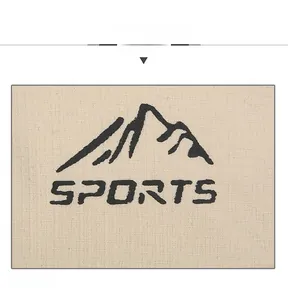 Close-up of printed SPORTS lettering and mountain logo on beige mesh baseball cap