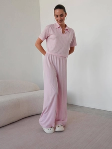 Pink knit two-piece set featuring short sleeve polo top and high waist wide leg pants